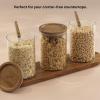 imageJoyJolt Holden 32oz Stackable Glass Storage Containers with Lids Scoops and Tray Clear Airtight Food Canister Set of 3 wAcacia Wood Lids Round Stacking Pantry and Kitchen Containers wScoop